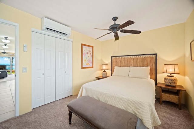 4-1250 Kuhio Hwy Unit G204, Kapaa, HI 96746 - bedroom with a wall mounted AC, carpet flooring, a closet, and a ceiling fan