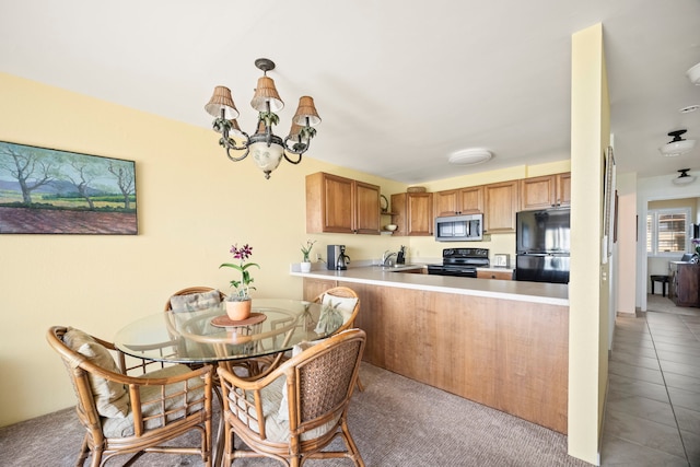 4-1250 Kuhio Hwy Unit G204, Kapaa, HI 96746 - carpeted dining room featuring a sink and a chandelier
