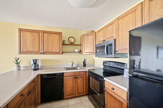 4-1250 Kuhio Hwy Unit G204, Kapaa, HI 96746 - kitchen featuring black appliances, light tile patterned floors, light countertops, and open shelves