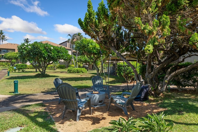 4-1250 Kuhio Hwy Unit G204, Kapaa, HI 96746 - view of grassy yard featuring an outdoor fire pit