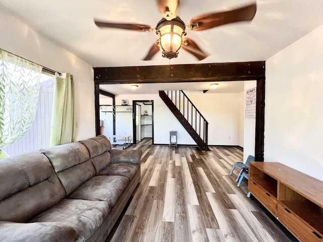 94-6347 Makai St, Naalehu, HI 96772 - living room with beam ceiling, wood finished floors, stairs, and a ceiling fan