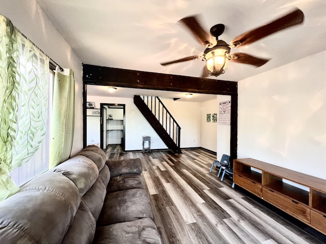 94-6347 Makai St, Naalehu, HI 96772 - living room with wood finished floors, ceiling fan, stairway, and beam ceiling