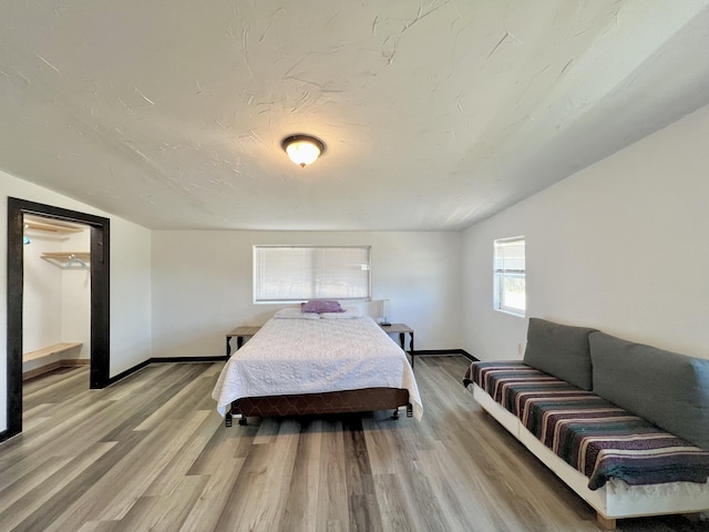 94-6347 Makai St, Naalehu, HI 96772 - bedroom with vaulted ceiling and light wood-style floors