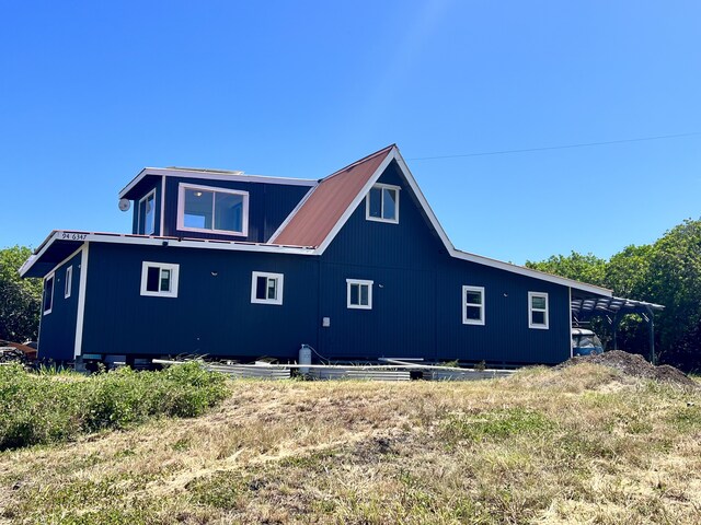 94-6347 Makai St, Naalehu, HI 96772 - view of property exterior featuring a metal roof
