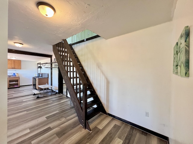 94-6347 Makai St, Naalehu, HI 96772 - stairs featuring wood finished floors and baseboards