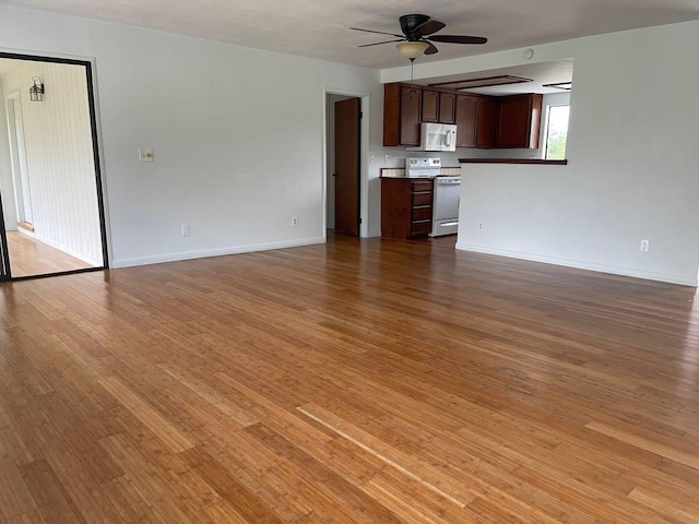 94-5868 Kanaloa Pl, Naalehu, HI 96772 - unfurnished living room with ceiling fan and light wood finished floors