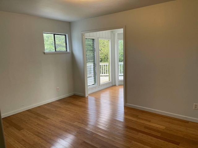 94-5868 Kanaloa Pl, Naalehu, HI 96772 - spare room with baseboards and hardwood / wood-style floors
