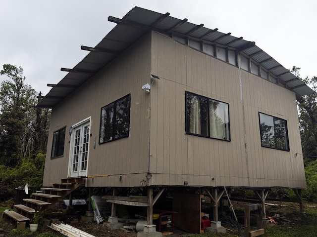 11-1834 Kolea St, Mountain View, HI 96771 - view of home's exterior with french doors and entry steps
