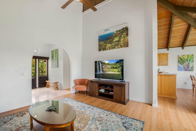 1901 Poipu Rd Unit 633, Koloa, HI 96756 - living room with arched walkways, high vaulted ceiling, light wood-style floors, a ceiling fan, and a wooden ceiling with exposed beams