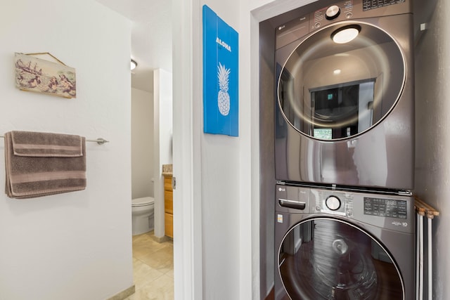 1901 Poipu Rd Unit 633, Koloa, HI 96756 - washroom with stacked washing machine and dryer and tile patterned flooring