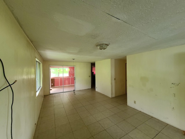 130 Popolo St, Hilo, HI 96720 - spare room with a textured ceiling and light tile patterned floors