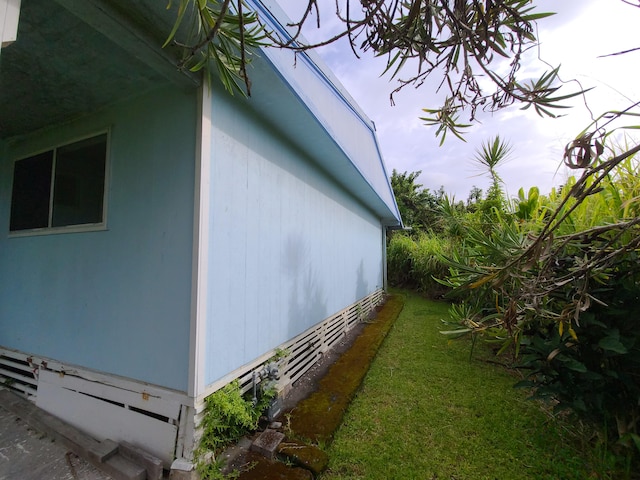 130 Popolo St, Hilo, HI 96720 - view of property exterior with a yard