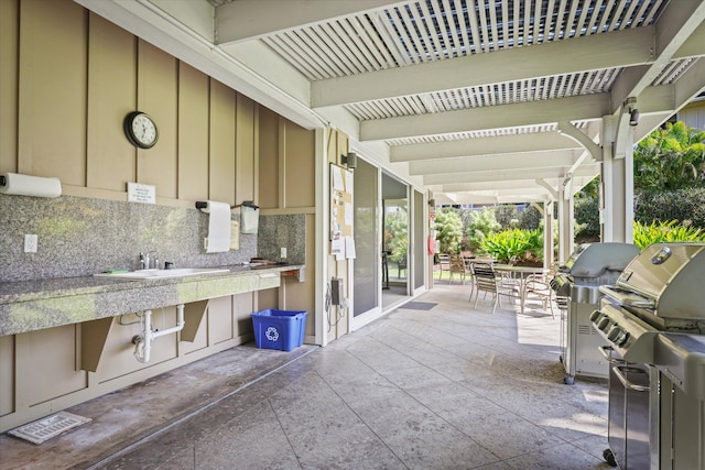75-5919 Alii Dr Unit Jj2, Kailua-Kona, HI 96740 - view of patio / terrace featuring outdoor dining space and an outdoor kitchen