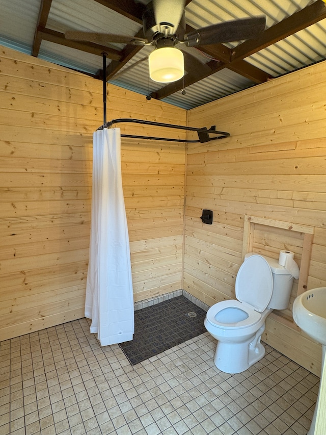 15-594 S Puni Mauka Loop, Pahoa, HI 96778 - full bathroom with wooden walls, a tile shower, a ceiling fan, and tile patterned floors
