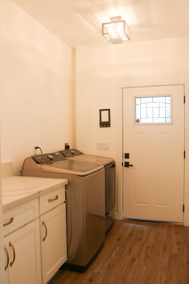 15-1393 29th Ave, Keaau, HI 96749 - laundry room featuring washing machine and clothes dryer, cabinet space, and dark wood-type flooring