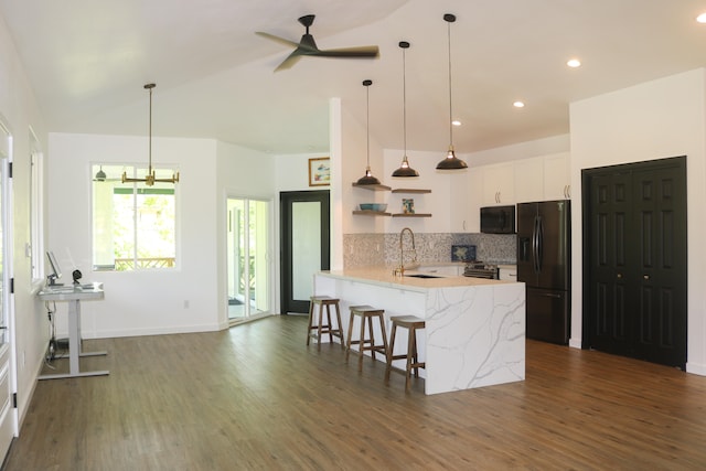15-1393 29th Ave, Keaau, HI 96749 - kitchen featuring black appliances, open shelves, dark wood-style floors, ceiling fan, and a peninsula