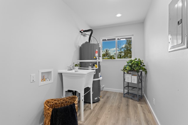15-1698 5th Ave, Keaau, HI 96749 - laundry room with electric panel, strapped water heater, hookup for a washing machine, light wood finished floors, and recessed lighting