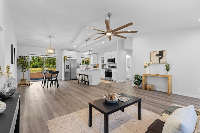 15-1698 5th Ave, Keaau, HI 96749 - living area with lofted ceiling, recessed lighting, a ceiling fan, and light wood-style flooring