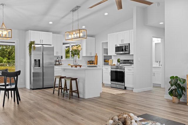 15-1698 5th Ave, Keaau, HI 96749 - kitchen featuring stainless steel appliances, a chandelier, a kitchen island, recessed lighting, and white cabinets