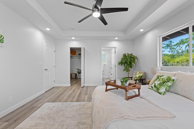 15-1698 5th Ave, Keaau, HI 96749 - bedroom featuring a raised ceiling, recessed lighting, light wood-style flooring, a walk in closet, and ensuite bath