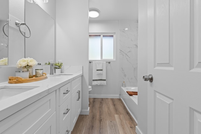15-1698 5th Ave, Keaau, HI 96749 - full bathroom with double vanity, wood finished floors, and washtub / shower combination
