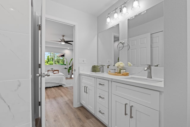 15-1698 5th Ave, Keaau, HI 96749 - ensuite bathroom with double vanity, wood finished floors, and ceiling fan