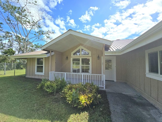 15-1581 Railroad Ave, Keaau, HI 96749 - property entrance featuring a metal roof, a standing seam roof, and covered porch