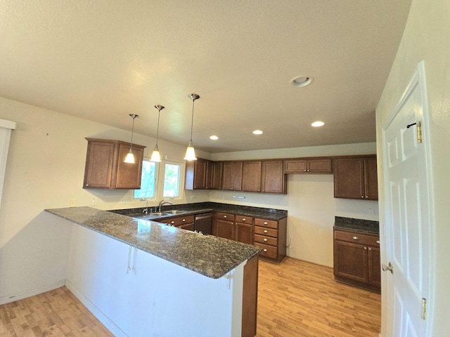15-1581 Railroad Ave, Keaau, HI 96749 - kitchen with a peninsula, light wood-type flooring, stainless steel dishwasher, dark stone countertops, and recessed lighting