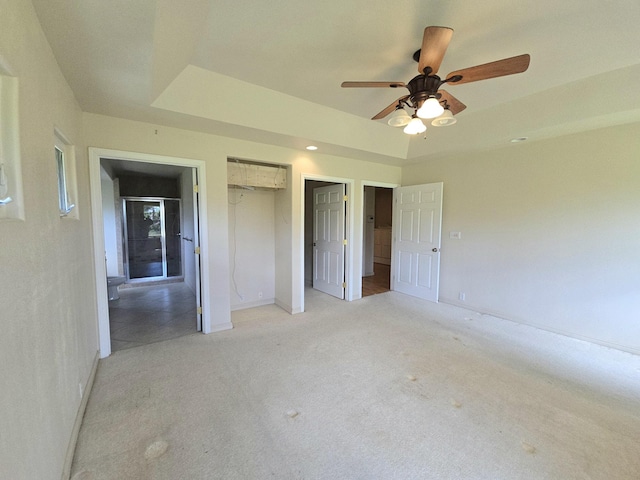 15-1581 Railroad Ave, Keaau, HI 96749 - unfurnished bedroom with light carpet, a raised ceiling, and a ceiling fan