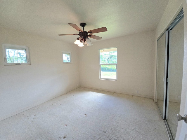 15-1581 Railroad Ave, Keaau, HI 96749 - unfurnished bedroom with a closet, light carpet, and ceiling fan