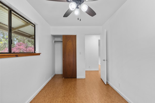 13-3401 Alapai St, Pahoa, HI 96778 - unfurnished bedroom featuring a closet, ceiling fan, and light wood-style floors