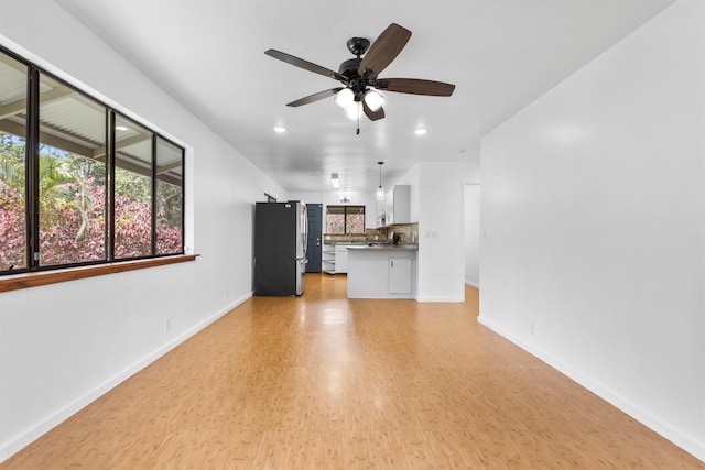 13-3401 Alapai St, Pahoa, HI 96778 - unfurnished living room with a ceiling fan, recessed lighting, and light wood-style flooring