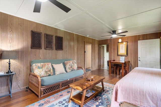 14-3342 Kaululaau Rd Unit 3, Pahoa, HI 96778 - bedroom featuring wooden walls, wood finished floors, and ceiling fan