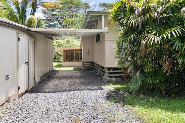 14-3342 Kaululaau Rd Unit 3, Pahoa, HI 96778 - view of property exterior featuring a carport