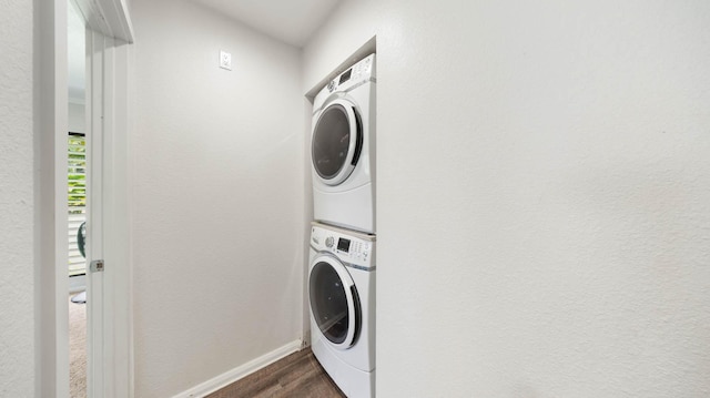 328 Molo St, Kapaa, HI 96746 - washroom featuring stacked washing machine and dryer and dark wood-style floors