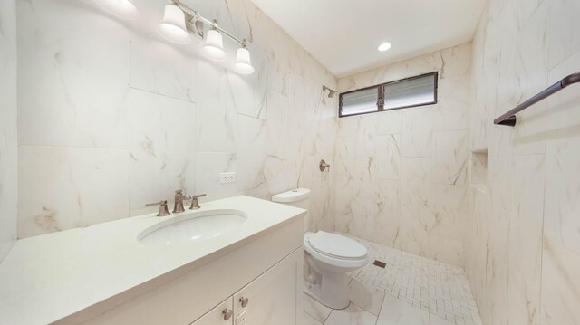 328 Molo St, Kapaa, HI 96746 - full bathroom featuring a tile shower, vanity, and tile walls