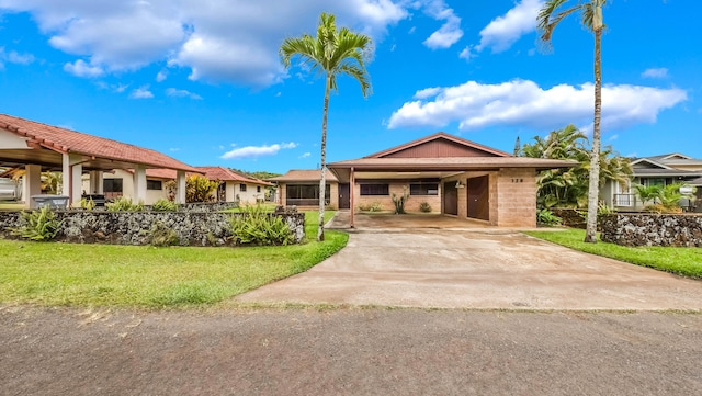 328 Molo St, Kapaa, HI 96746 - ranch-style house with a carport, a front yard, and concrete driveway