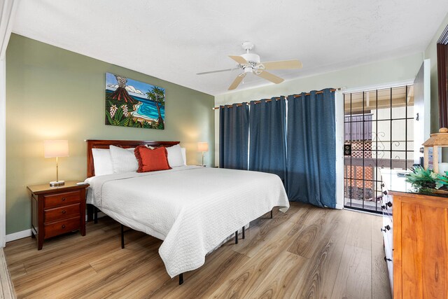 75-6008 Alii Dr Unit 219, Kailua-Kona, HI 96740 - bedroom featuring wood finished floors and a ceiling fan