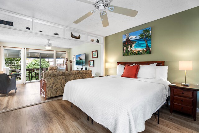 75-6008 Alii Dr Unit 219, Kailua-Kona, HI 96740 - bedroom featuring access to exterior, wood finished floors, and a ceiling fan