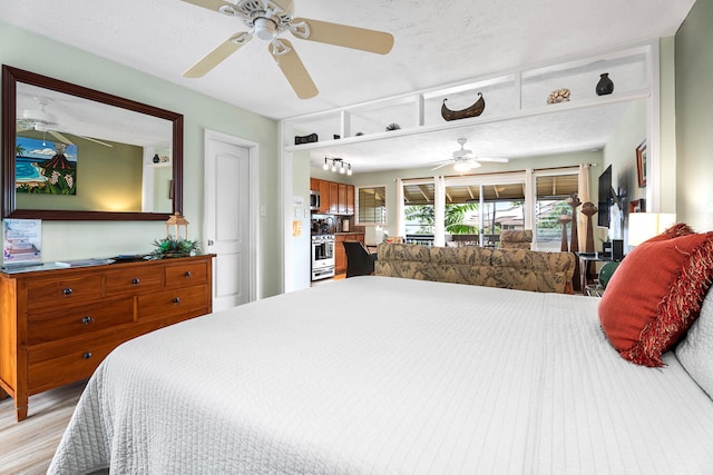 75-6008 Alii Dr Unit 219, Kailua-Kona, HI 96740 - bedroom with light wood finished floors and access to outside