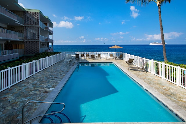 75-6008 Alii Dr Unit 219, Kailua-Kona, HI 96740 - community pool with a water view and a patio