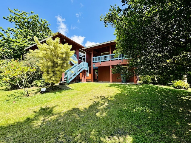 4523 Uku Lii Pl, Hanalei, HI 96714 - back of property featuring stairway, a lawn, and a deck