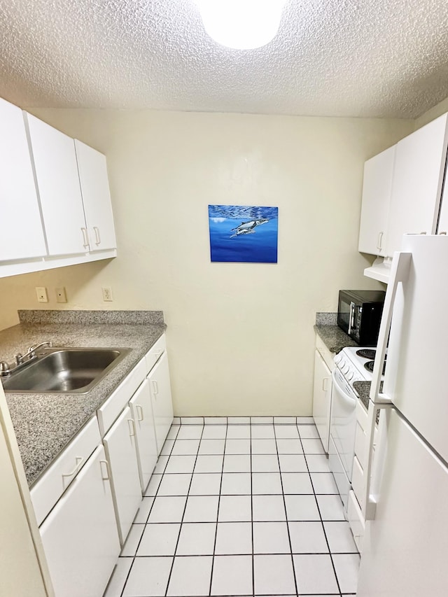525 Aleka Lp Unit A2, Kapaa, HI 96746 - kitchen with white appliances, white cabinetry, a textured ceiling, light countertops, and premium range hood