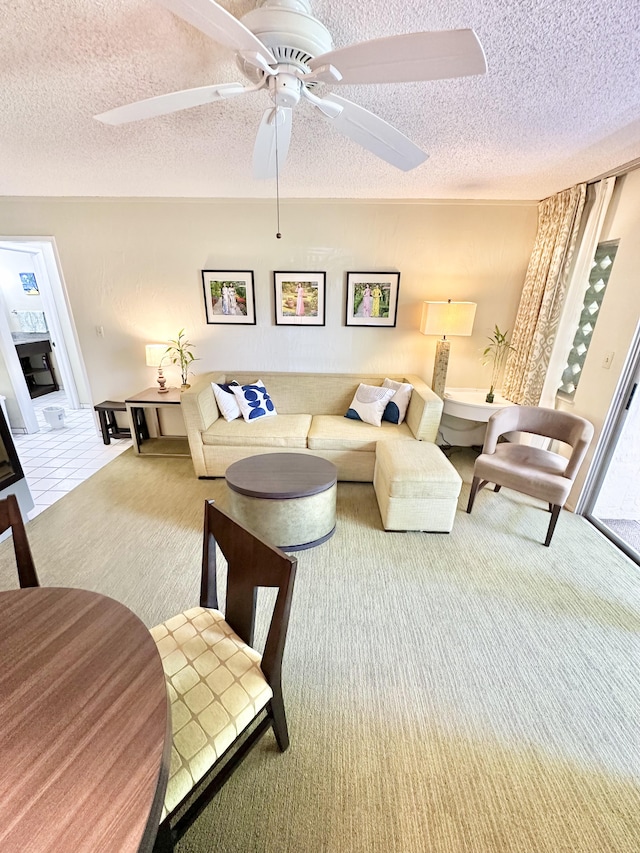 525 Aleka Lp Unit A2, Kapaa, HI 96746 - carpeted living room with a textured ceiling and ceiling fan