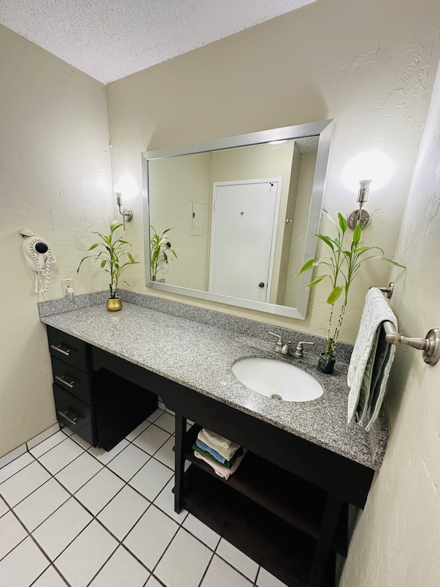 525 Aleka Lp Unit A2, Kapaa, HI 96746 - bathroom featuring vanity, tile patterned flooring, and a textured ceiling