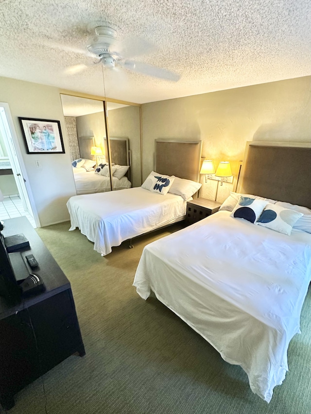 525 Aleka Lp Unit A2, Kapaa, HI 96746 - bedroom featuring carpet flooring, a textured ceiling, and a ceiling fan