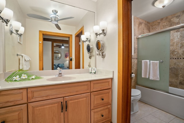2253 Poipu Rd Unit 320, Koloa, HI 96756 - bathroom featuring ceiling fan, tile patterned flooring, vanity, and bath / shower combo with glass door