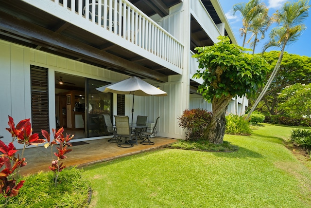 2253 Poipu Rd Unit 320, Koloa, HI 96756 - exterior space featuring a balcony, a lawn, and a patio