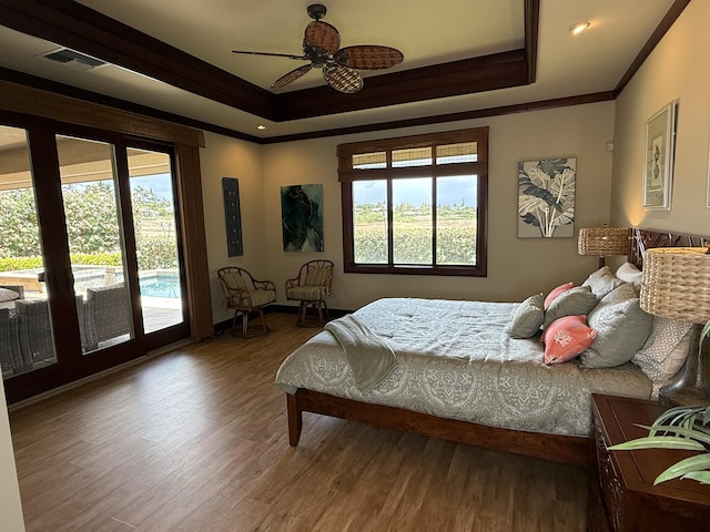 62-3600 Amaui Pl Unit 345, Kamuela, HI 96743 - bedroom featuring ornamental molding, a tray ceiling, access to outside, wood finished floors, and a ceiling fan