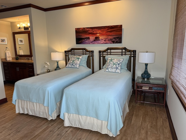 62-3600 Amaui Pl Unit 345, Kamuela, HI 96743 - bedroom with wood finished floors, a chandelier, and connected bathroom